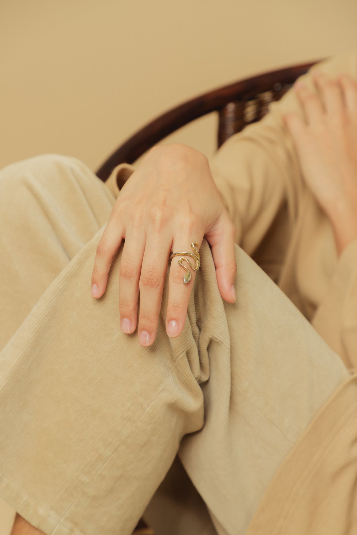 Woman with Ring in Beige Monochrome Outfit